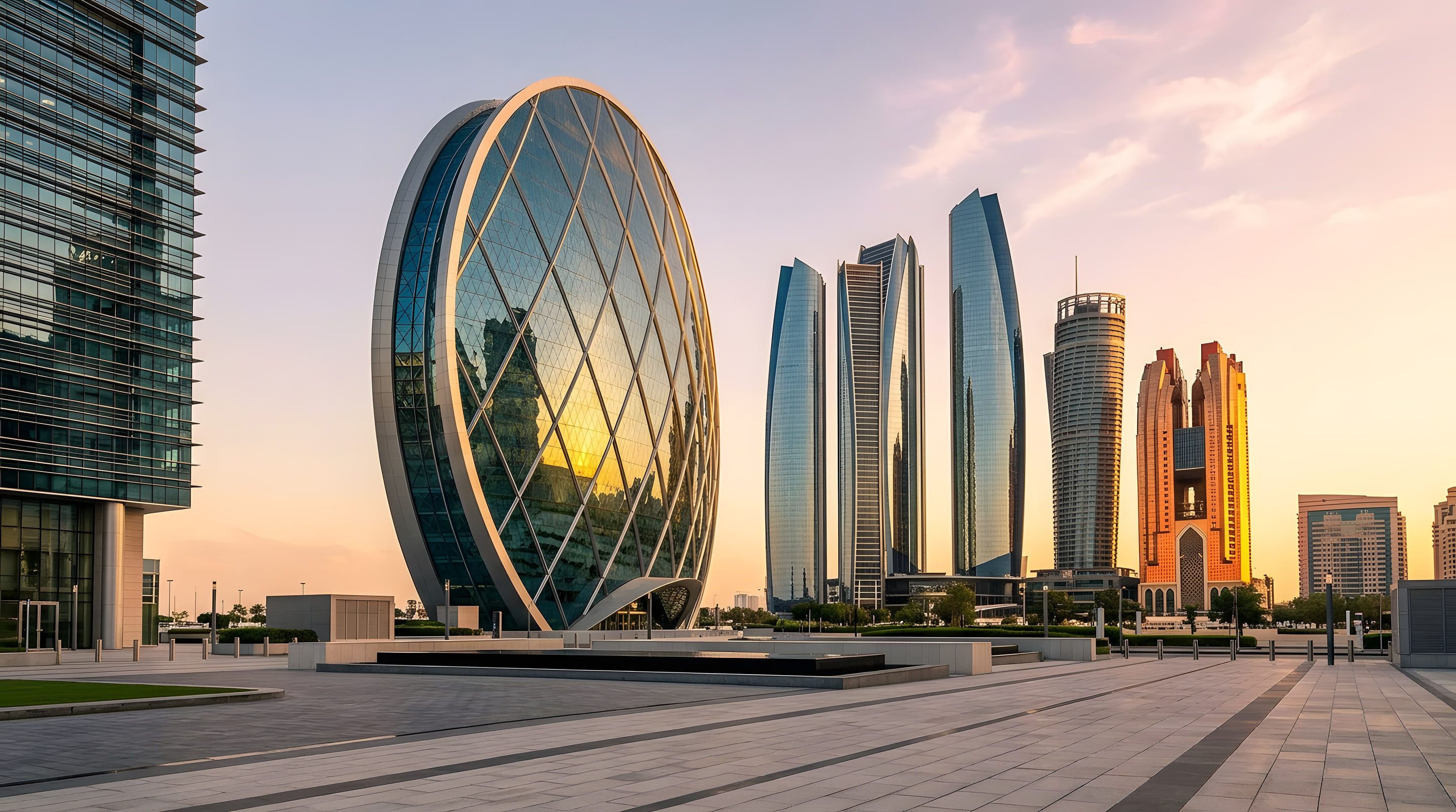 Contemporary glass towers in Abu Dhabi catching golden-hour light